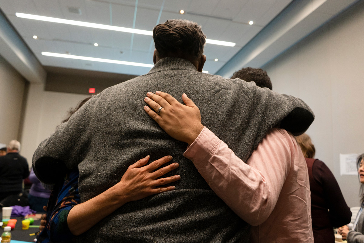 Several people embracing.