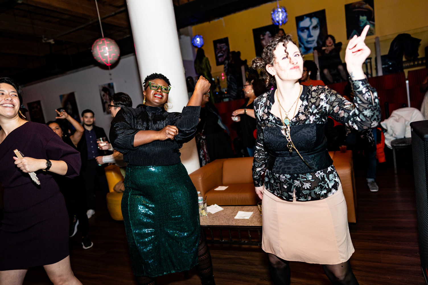 People dancing with hands in the air.