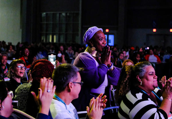 People applauding from audience.