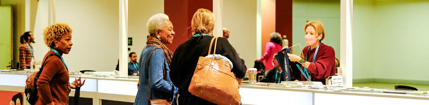 attendees checking in at registration 