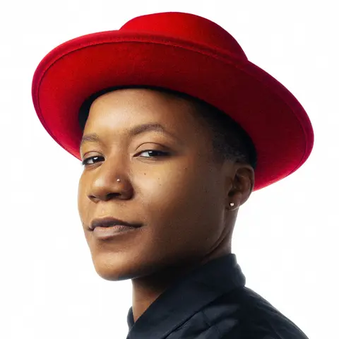 Boogie Lov in a red, rimmed hat.