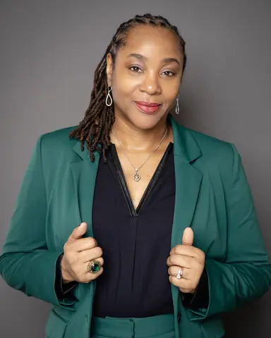 Chrystalyn Hampton wearing green jacket.